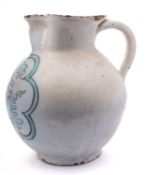 A massive Umbrian maiolica armorial jug, probably Orvieto, of globular form with pinched spout,