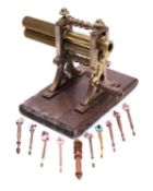 A Victorian brass, steel and oak mounted collar crimper,