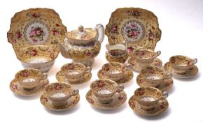 A Coalport porcelain tea service, comprising teapot and cover [spout repaired and knop pinned],