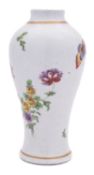 A Plymouth baluster vase painted in bright enamels with a flower spray,
