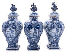A garniture of three Dutch delft ware vases,