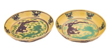 Two Chinese yellow ground saucers,