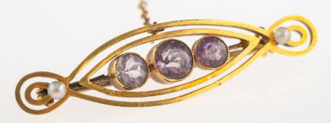 An amethyst set brooch, of oval openwork