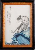 A Japanese porcelain panel decorated wit