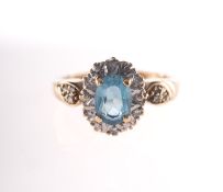 A 9ct gold blue topaz and diamond cluste