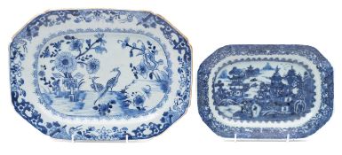 Two Chinese porcelain meat plates of octagonal form one painted in blue with two cranes in a garden