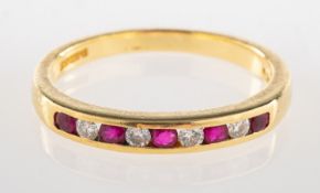 An 18ct gold ruby & diamond half eternity ring,
