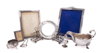 A mixed group of silver including; a large silver photograph frame by Henry Matthews,