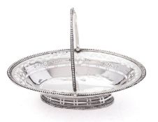 A George III silver swing handled bon bon dish by George Smith, London 1785, of oval form,