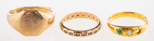 A group of three rings, including a 9ct gold signet ring with split shank, approx. size U, 6.
