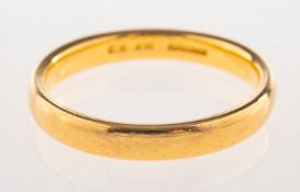 A plain wedding band, indistinct marks, size P1/2 to Q, 5.1grams.