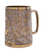 A Victorian Aesthetic Movement parcel silver-gilt mug probably by William Hutton and Son,