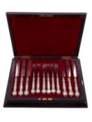 A late 19th/ early 20th century cased set of six pairs of silver plated dessert knives & forks,