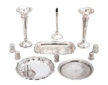A small mixed lot of silver, to include a pair of spill vases (loaded), a specimen vase (loaded),