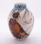 A Moorcroft pottery limited edition vase of oviform tube lined in the Pheasants of Snow Hollow