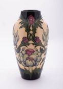 A Moorcroft limited edition pottery vase of slender oviform tube lined in the Garden Castle pattern