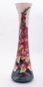 A Moorcroft pottery limited edition vase of slender waisted form tube lined in the Illumination