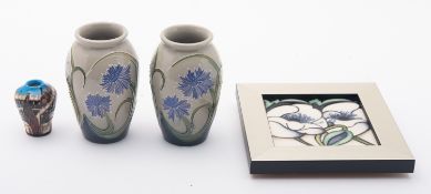 Four pieces of Moorcroft Pottery. Compri