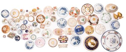 An accumulation of primarily porcelain covers, stoppers and lids, domestic, European and Chinese,