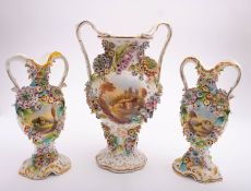 A garniture of three Staffordshire porce