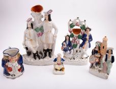A mixed lot of Victorian Staffordshire pottery figures including a large group titled 'Robin Hood';