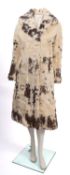 A collection of four fur coats. Comprisi
