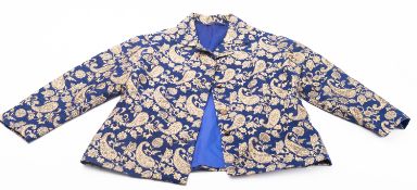 A lady's navy and gold paisley cotton su