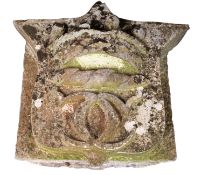 A carved limestone armorial, probably a keystone,