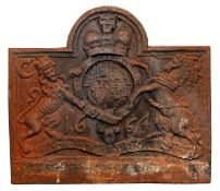 A Charles II style cast iron fireback with Royal crest and the date of 1664, 74 x 65cm.