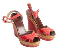 Christian Louboutin, A pair of red leather open toe Louboutin wedges, heel height 5 inches, size 37.