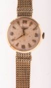 Longines a lady's 9K gold wristwatch the round cream dial having raised dauphine and Arabic