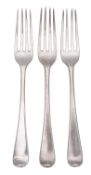 A George III trio of North Country provincial silver dessert forks, Old English pattern, crested,