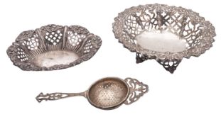 A small mixed lot of silver, comprising of 2 Victorian bonbon dishes and a tea strainer,