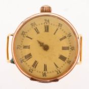 A 12K gold pocket watch converted to a wristwatch the white enamel dial having black Arabic