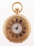 A small 18K gold half-hunter pocket watch the dial with black Roman numerals,
