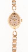 Rotary a gold-plated and gold lady's wristwatch the round silvered dial having raised baton