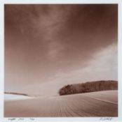 Paul Hart (British) 'Norfolk 2003' A black and white photograph showing a tilled field and woodland,