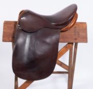 An unnamed 17 inch tan leather show saddle.