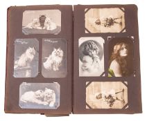 A collection of early 20th Century and later postcards in two albums.