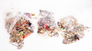 An accumulation of various costume jewellery including bangles, necklaces and brooches etc.