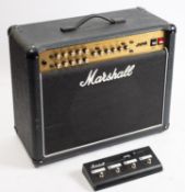A Marshall JVM 215C amplifier. With cover, 49cm high, 60cm high, together with Marshall foot pedal.