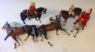 Five Beswick mounted horse and riders. Including three jockeys (two with damaged legs) etc.