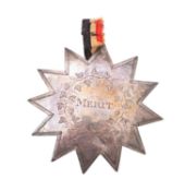 A William IV silver merit star.