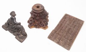 An 19th century carved linen fold panel, 33x18cm together with a wooden carved Corinthian capitol,