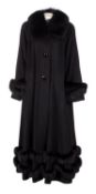 Belle Fare, a black cashmere full length coat with black fur trim to collar, sleeves and bottom,