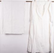 A collection of various linens and whitewears. Including tablecloths and aprons etc.