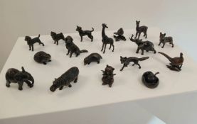 A collection of seventeen different solid bronze animals.