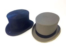 Two Moss Bros, Covent Garden top hats.