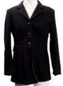 Three various black woollen riding jackets.
