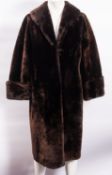 A 20th Century Beaver fur overcoat with polyester lining, 118cm long, 58cm wide.